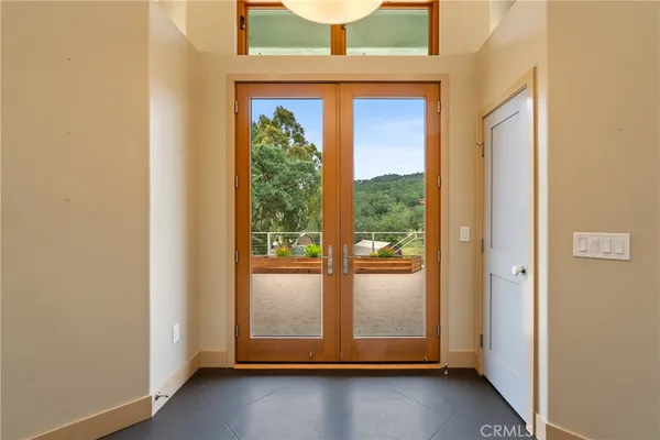 a kitchen with stainless steel appliances granite countertop a stove a sink and a large window
