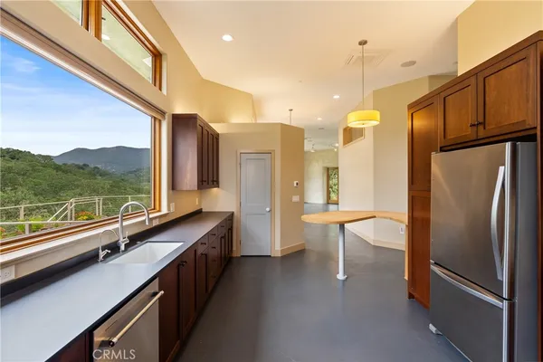 a view of a dining room with furniture window and outside view