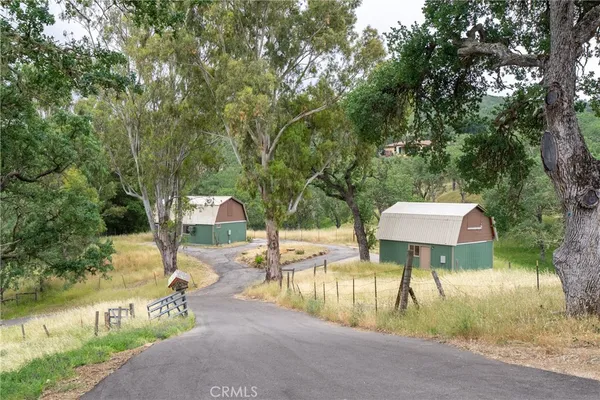 a view of a house with a yard and garage