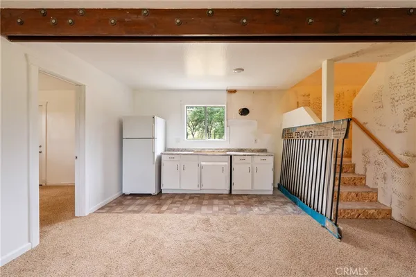 a view of a green field with lots of bushes