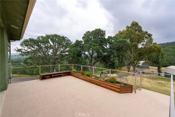 a view of a front door of the house and a yard