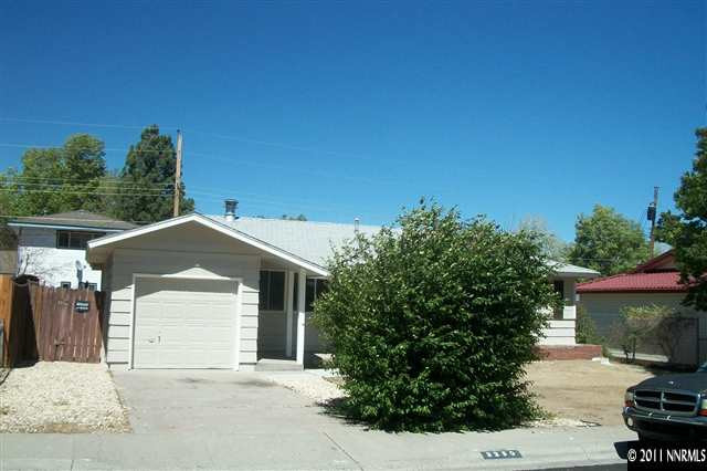 3250 Sandra Drive Reno, NV 89503 - Photo 1 of 1 a front view of a house with a yard and garage