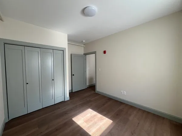 a view of an empty room and window