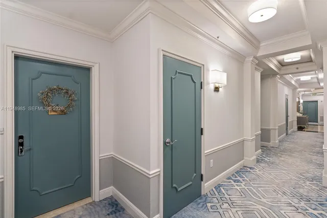 a living room with furniture kitchen and a large window