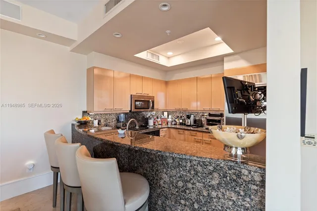 an aerial view of residential houses with city view