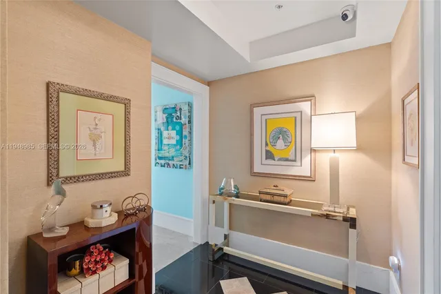 a dining room with furniture and a chandelier