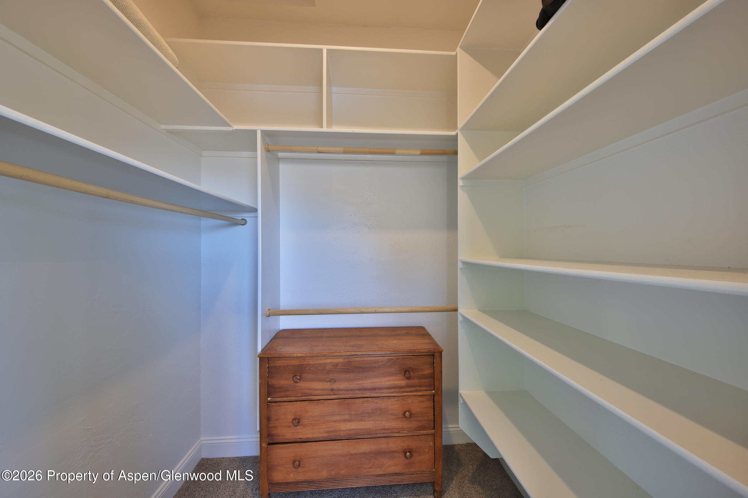 15086 45 45 1/2 Road De Beque, CO 81630 - Photo 11 of 40 a view of walk in closet with empty racks