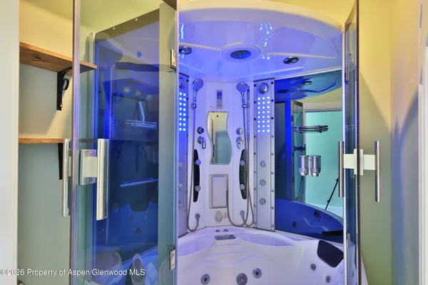 a bathroom with a sink a bath tub and shower