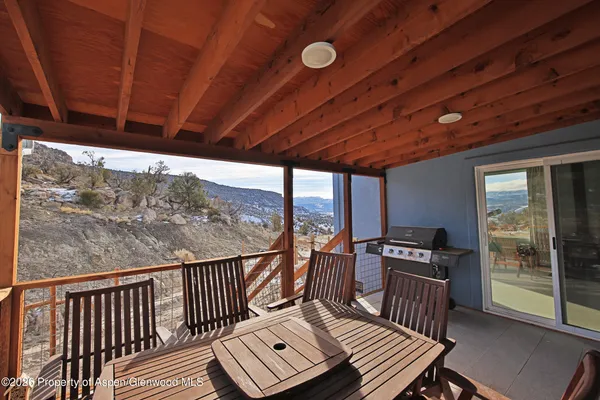 a view of a balcony with chairs
