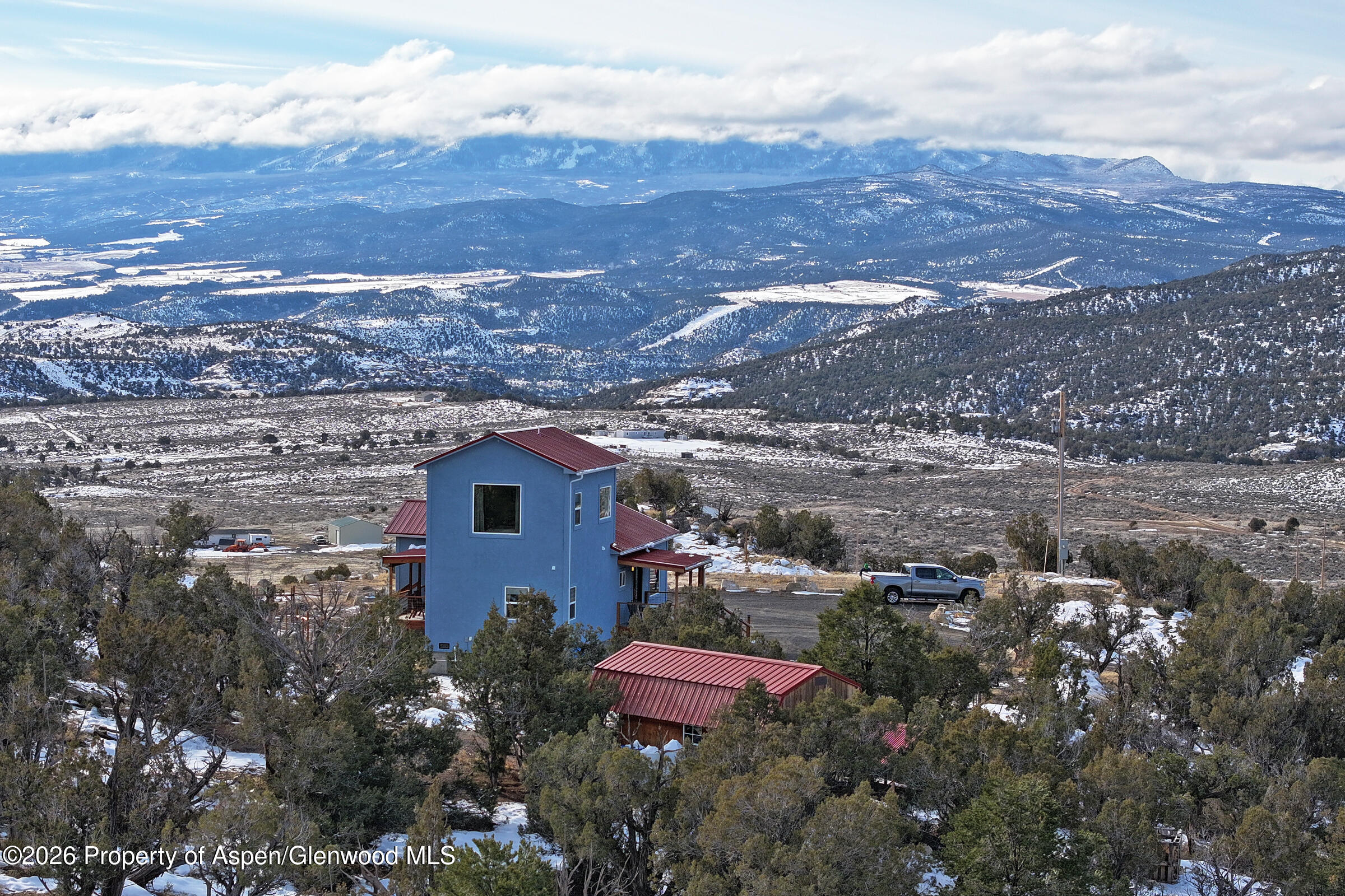 15086 45 45 1/2 Road De Beque, CO 81630 - Photo 32 of 40 a view of a house with a yard