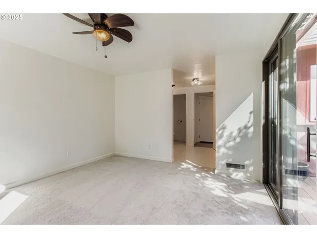 a bathroom with a shower sink and mirror