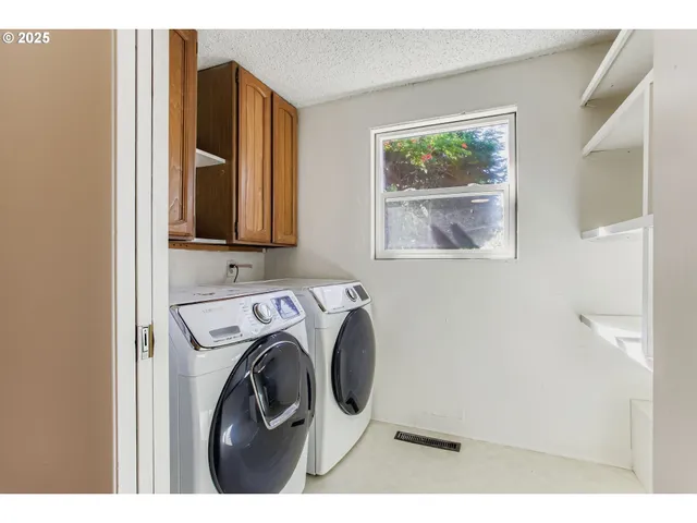 a view of a patio with a table and chairs