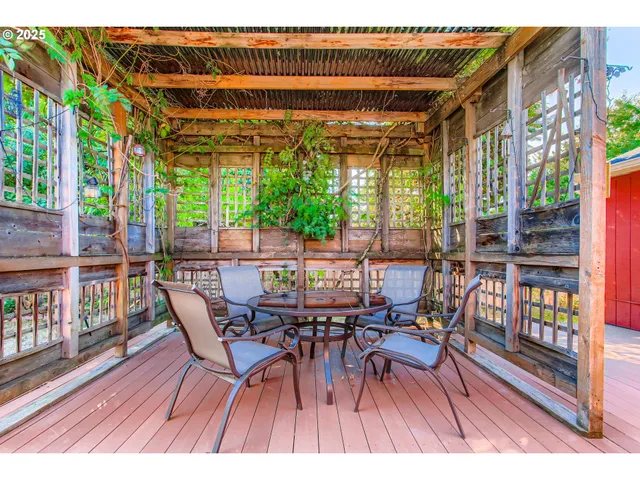 a wooden bench sitting in front of a building