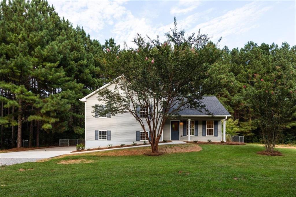 1932 Alcovy Station Road Covington, GA 30014 - Photo 1 of 1 front view of a house with a yard