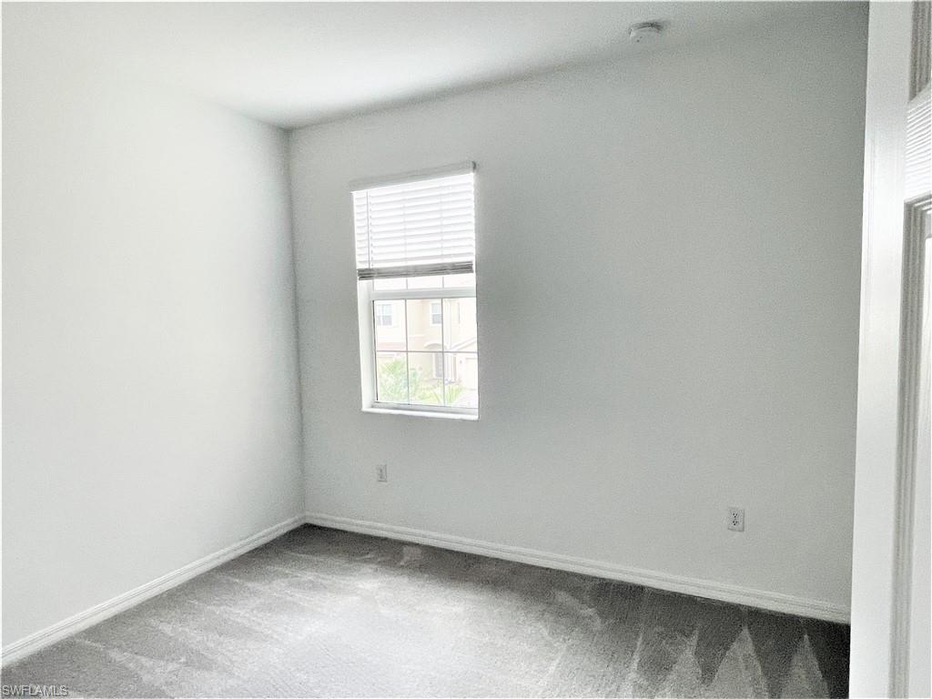 2775 Blossom Way Naples, FL 34120 - Photo 13 of 16 an empty room with a window