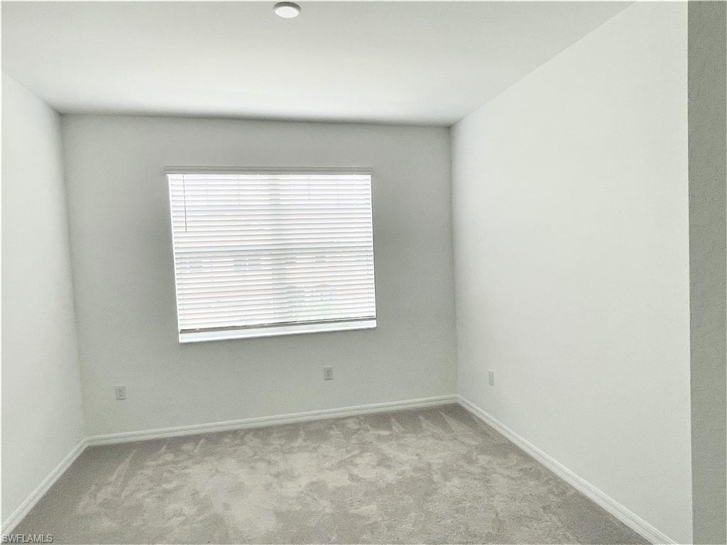 2775 Blossom Way Naples, FL 34120 - Photo 14 of 16 an empty room with a window