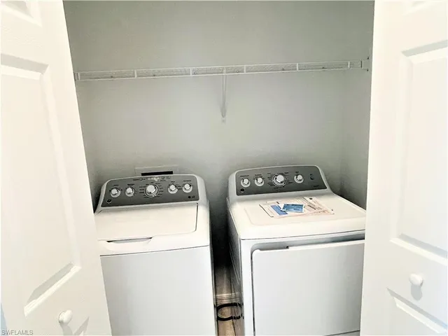 a utility room with dryer and washer