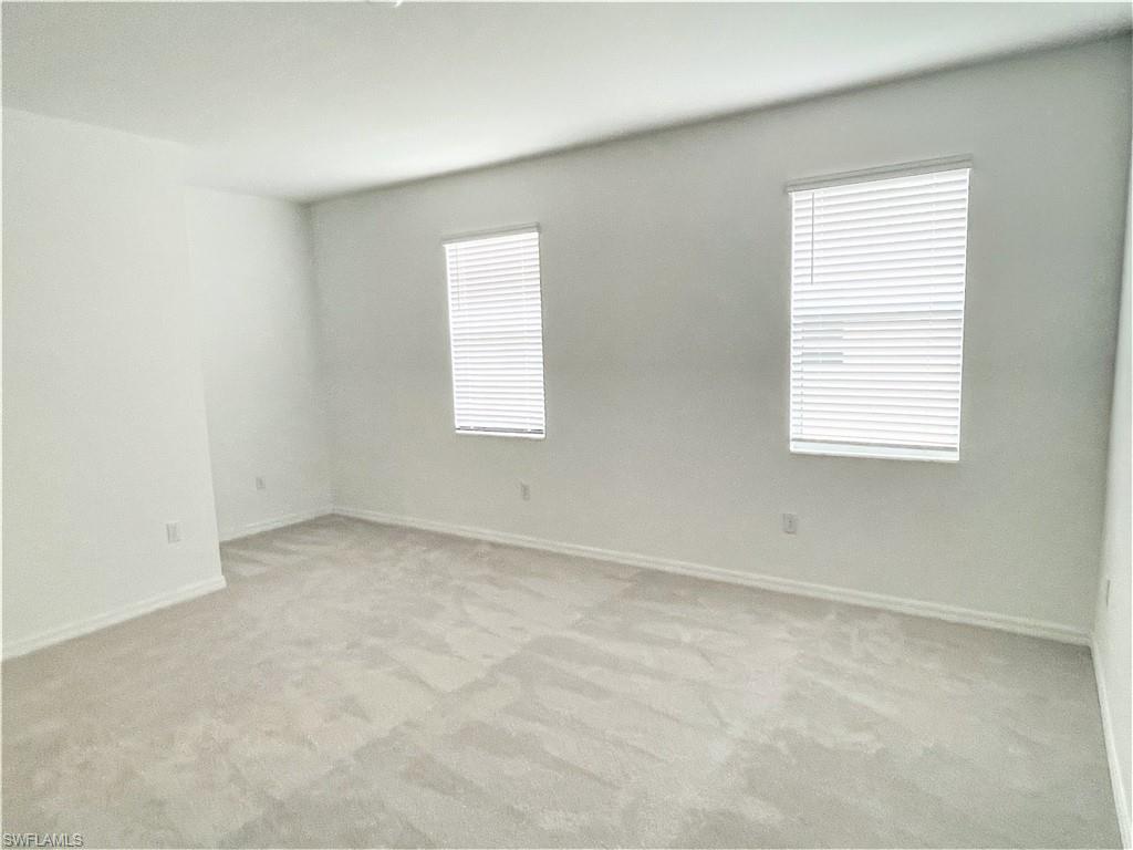 2775 Blossom Way Naples, FL 34120 - Photo 8 of 16 an empty room with a window