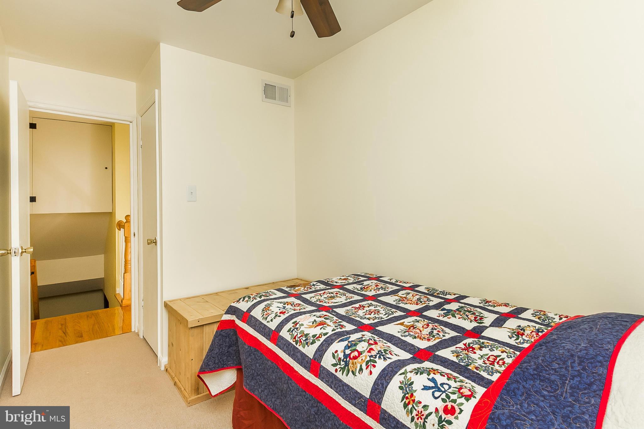 716 Aldworth Road Baltimore, MD 21222 - Photo 13 of 29 a bedroom with a bed and a lamp