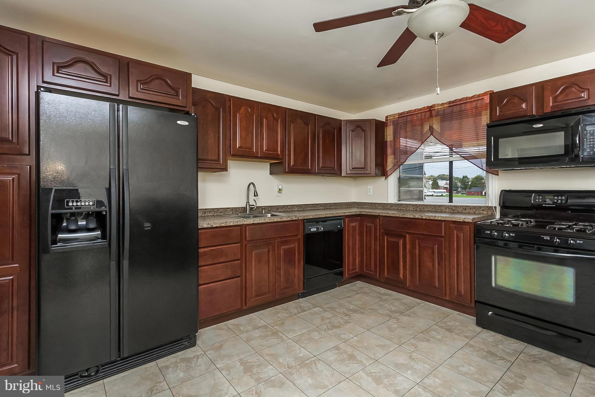 716 Aldworth Road Baltimore, MD 21222 - Photo 14 of 29 a kitchen with stainless steel appliances granite countertop a refrigerator a sink dishwasher a stove and a refrigerator