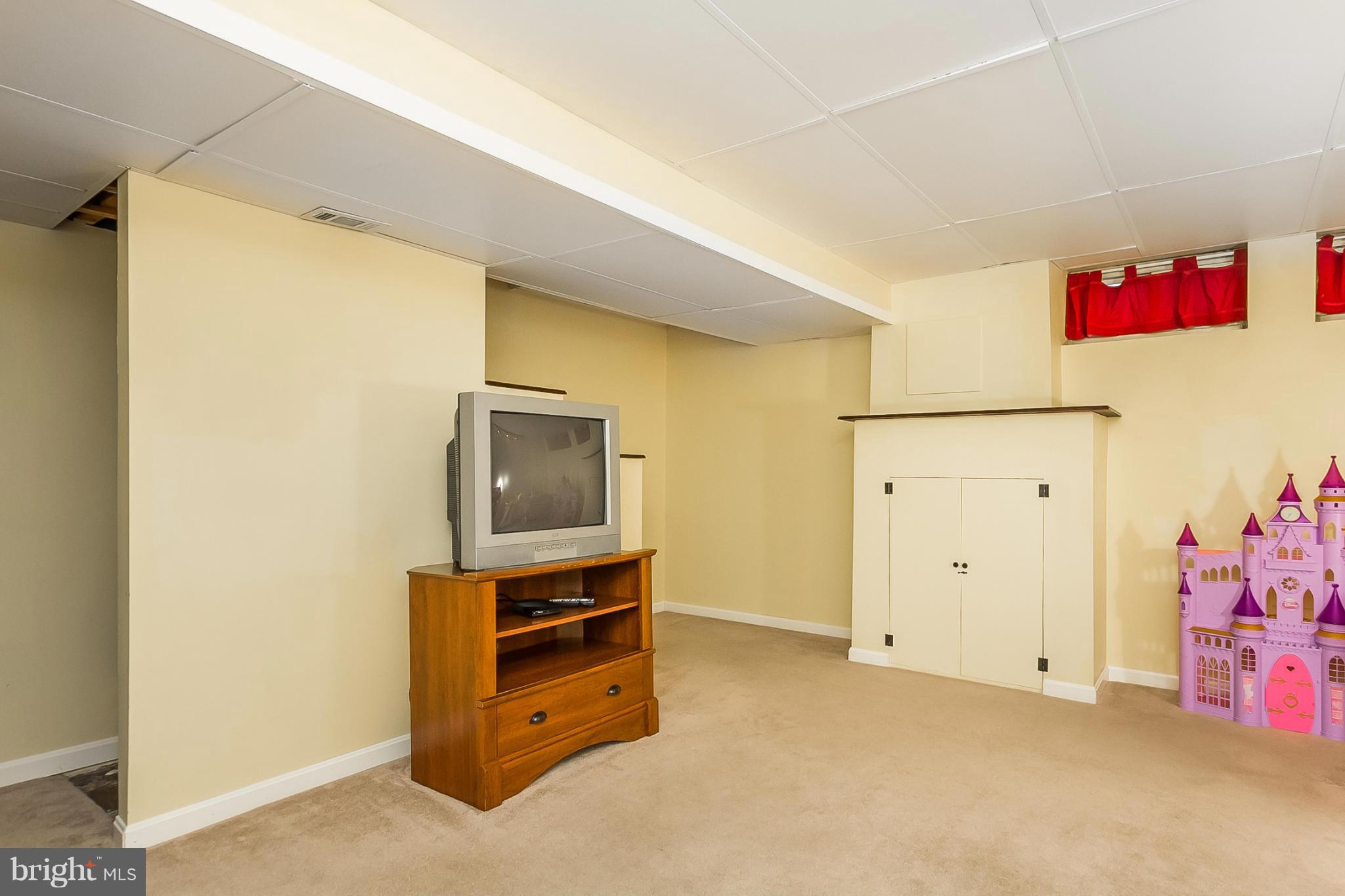 716 Aldworth Road Baltimore, MD 21222 - Photo 20 of 29 a room with furniture and flat screen tv