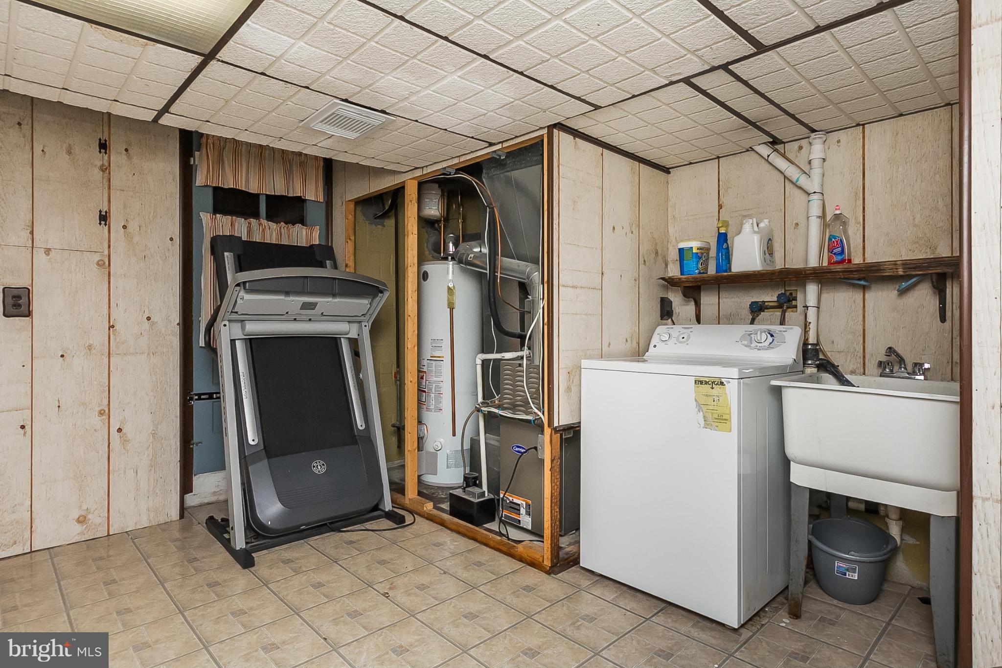 716 Aldworth Road Baltimore, MD 21222 - Photo 21 of 29 a view of a storage & utility room with washer and dryer