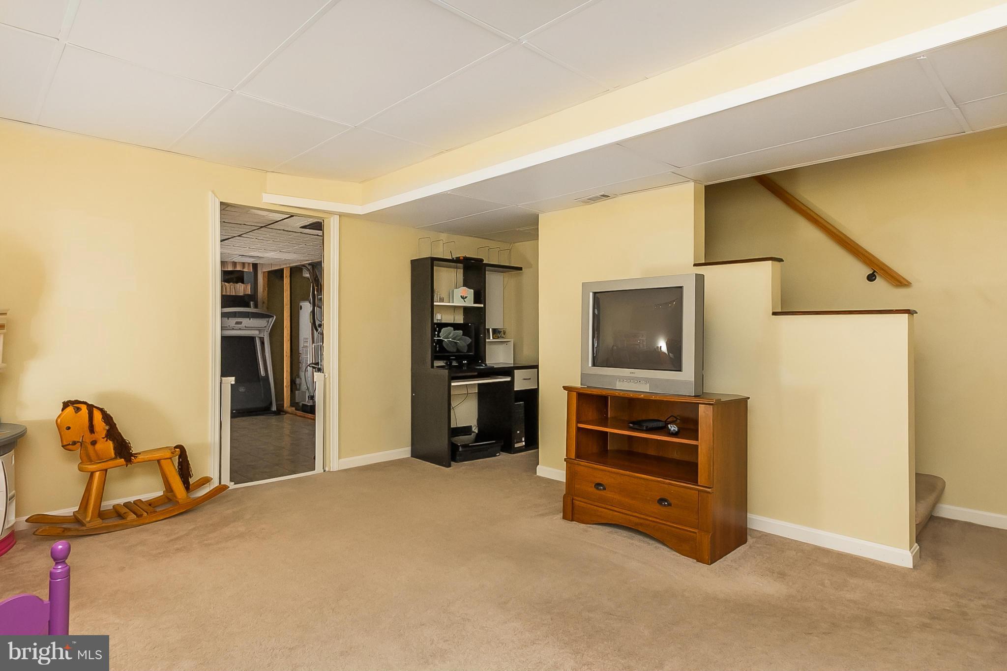 716 Aldworth Road Baltimore, MD 21222 - Photo 26 of 29 a view of an empty room with furniture and a window