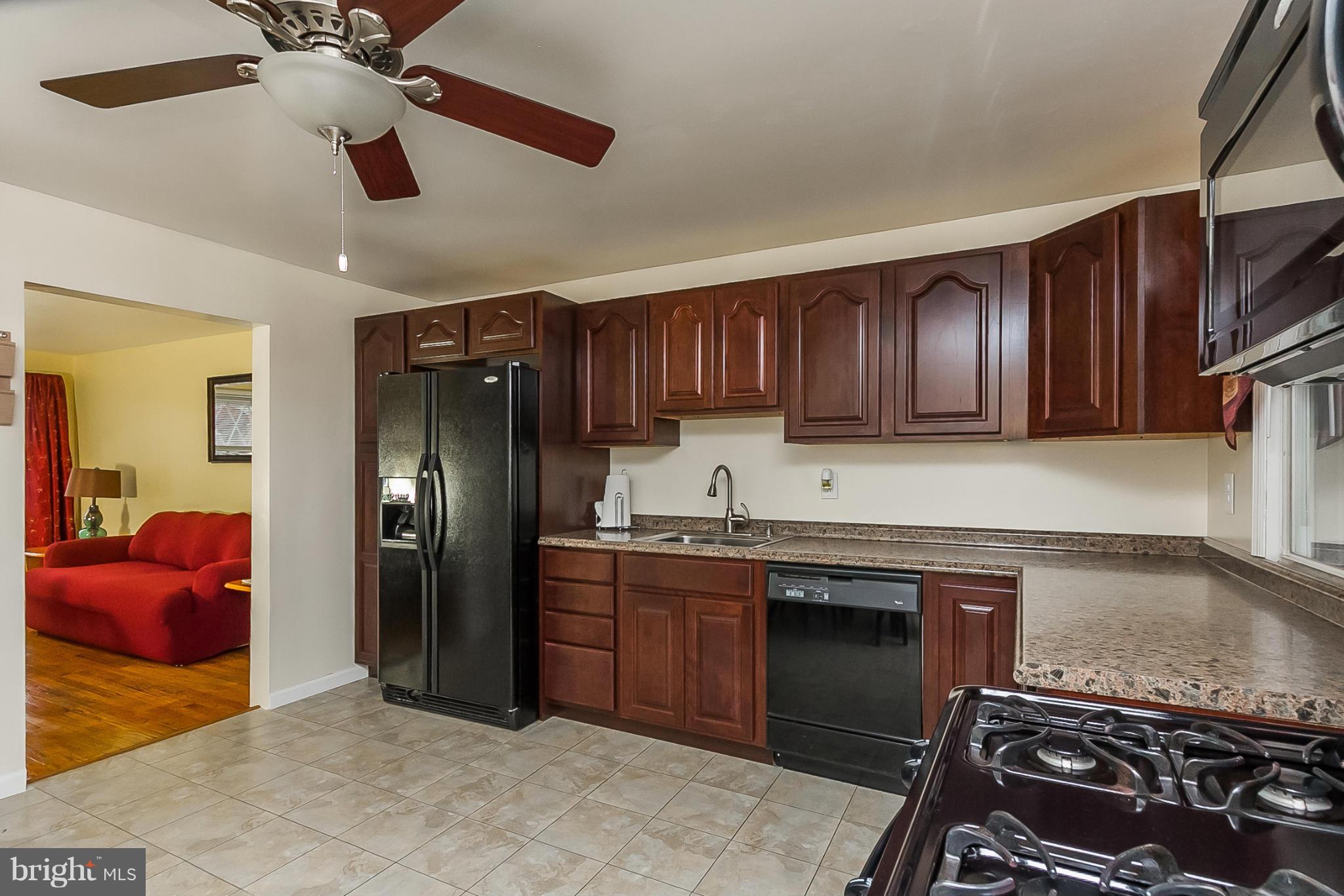716 Aldworth Road Baltimore, MD 21222 - Photo 7 of 29 a kitchen with stainless steel appliances granite countertop a refrigerator and a sink