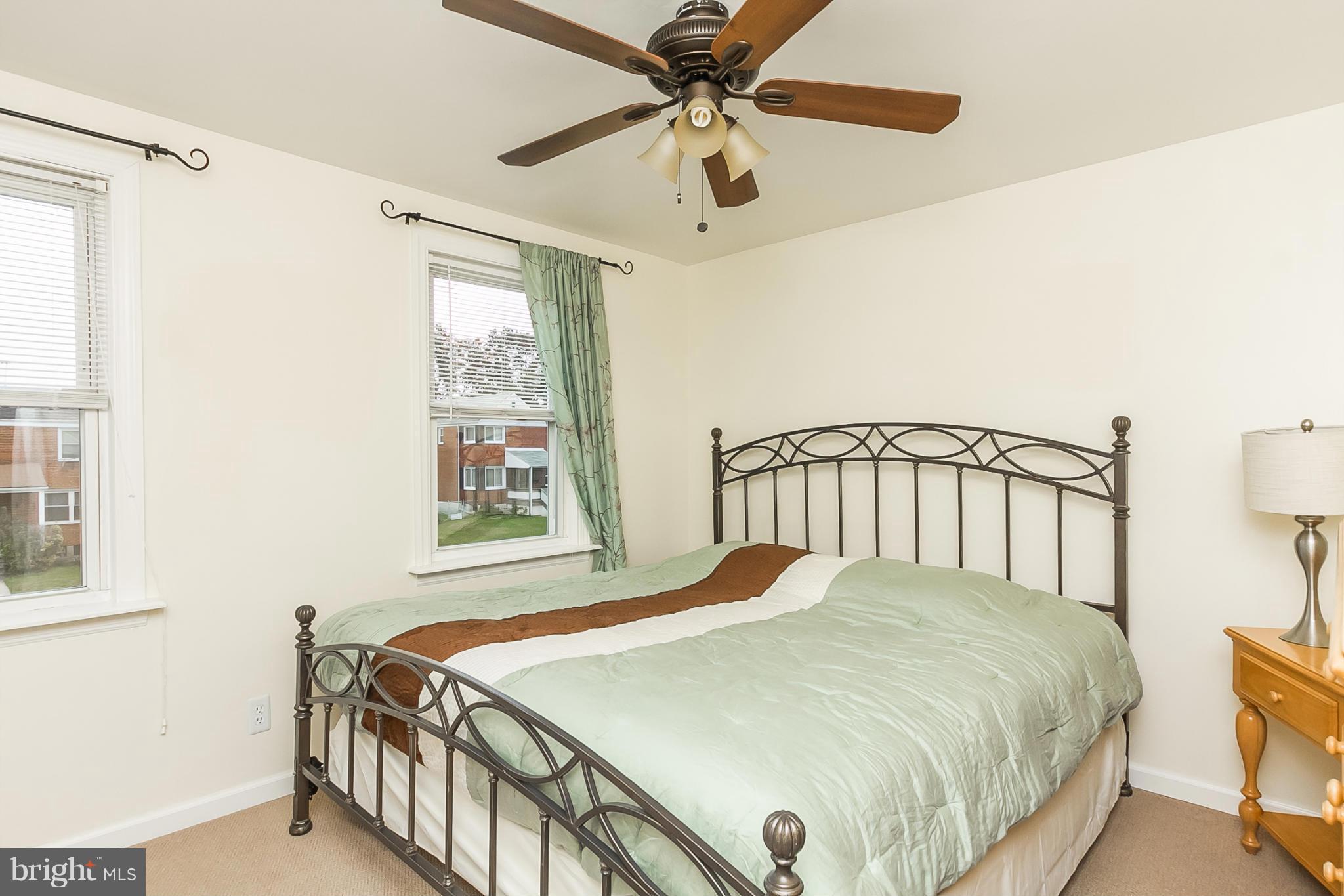 716 Aldworth Road Baltimore, MD 21222 - Photo 8 of 29 a bedroom with a bed and window