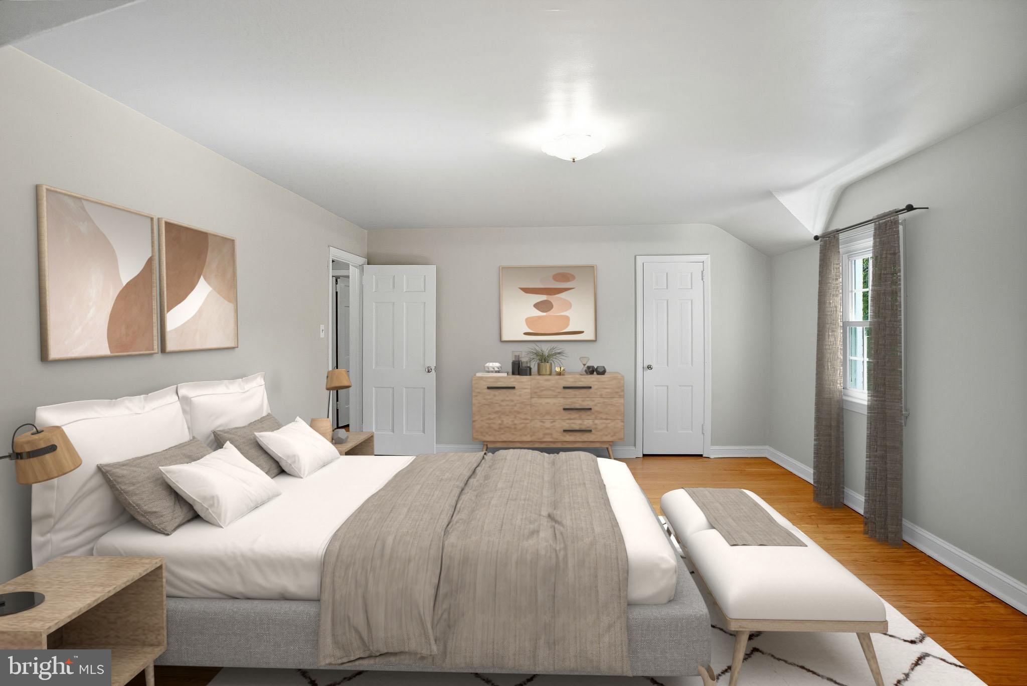 979 Edgewood Drive Springfield, PA 19064 - Photo 18 of 36 a bedroom with a bed and a painting on the wall