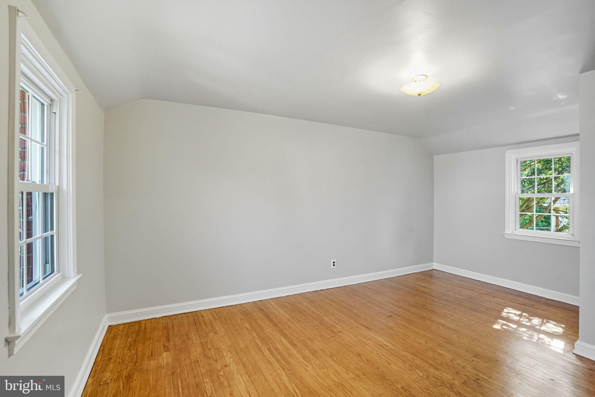 979 Edgewood Drive Springfield, PA 19064 - Photo 20 of 36 wooden floor in an empty room with a window