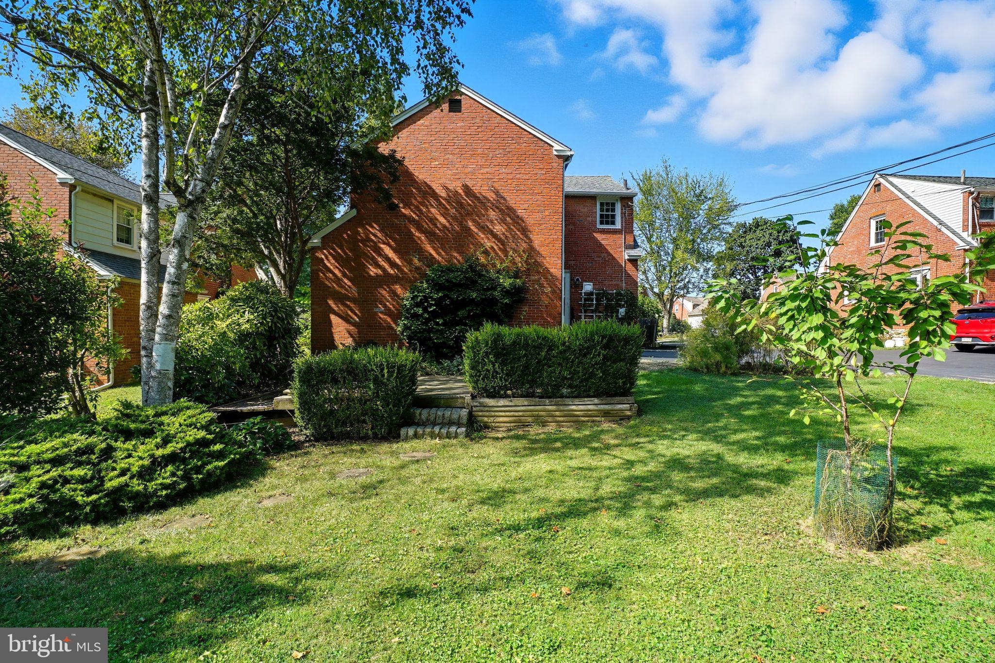 979 Edgewood Drive Springfield, PA 19064 - Photo 31 of 36 a view of a house with a backyard and a patio