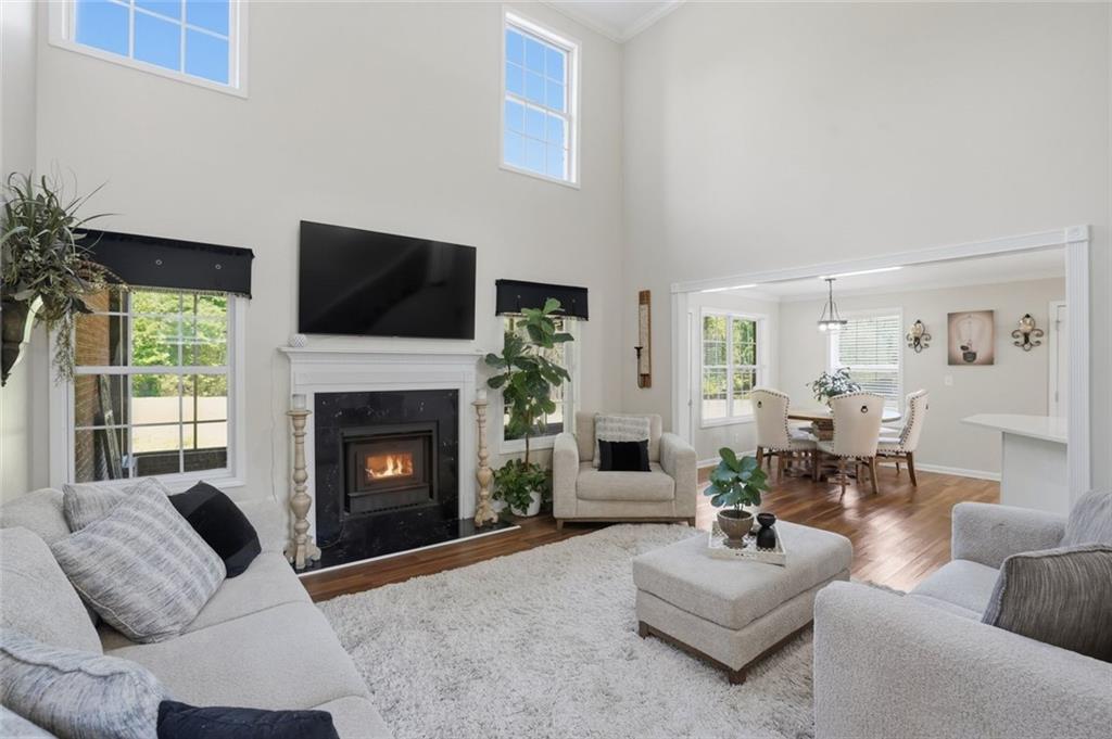 3675 Falls Trail Winston, GA 30187 - Photo 12 of 47 a living room with furniture a fireplace and a flat screen tv