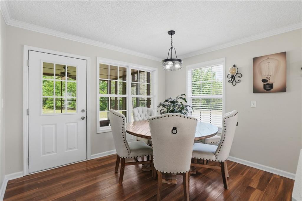 3675 Falls Trail Winston, GA 30187 - Photo 17 of 47 a view of a dining room with furniture window and wooden floor