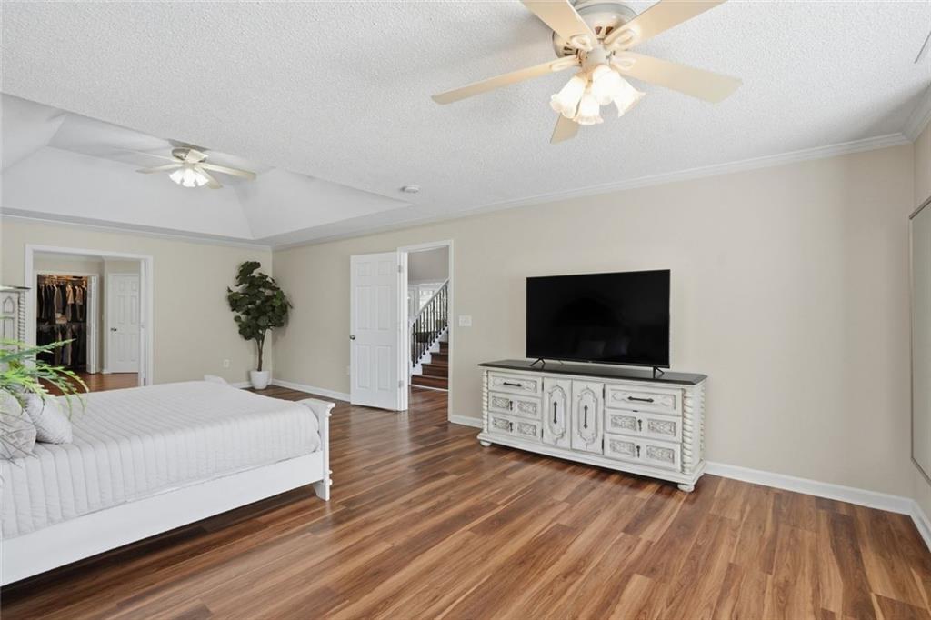 3675 Falls Trail Winston, GA 30187 - Photo 19 of 47 a bedroom with a bed and a flat screen tv