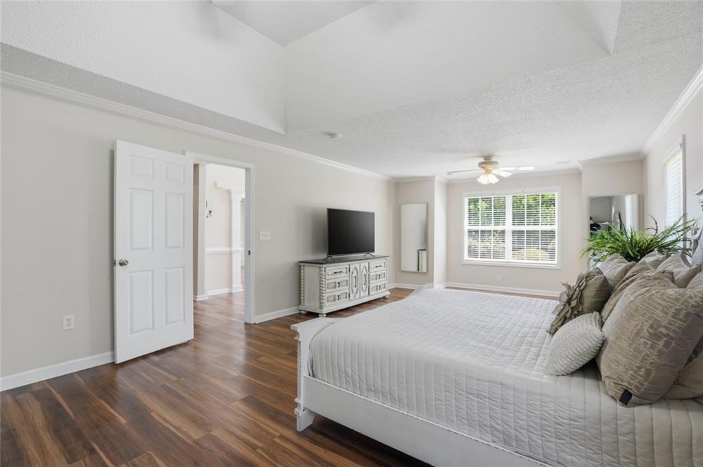 3675 Falls Trail Winston, GA 30187 - Photo 22 of 47 a bedroom with a bed and a flat screen tv