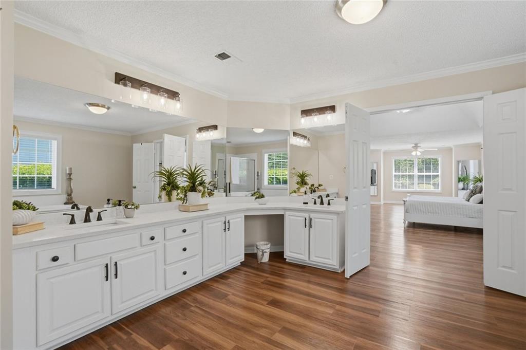 3675 Falls Trail Winston, GA 30187 - Photo 23 of 47 a kitchen with white cabinets and sink