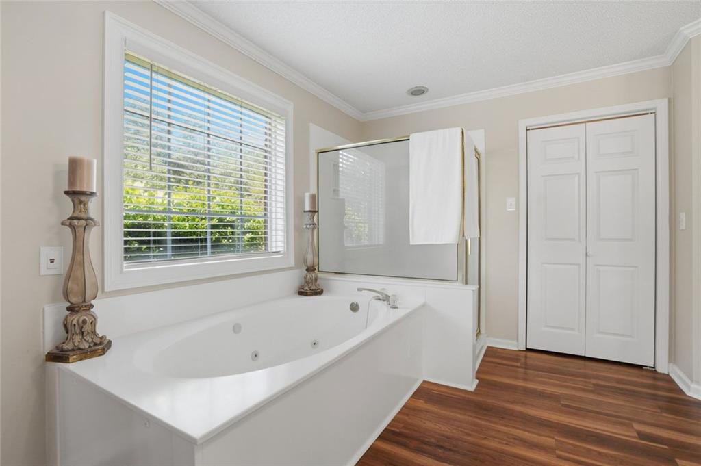 3675 Falls Trail Winston, GA 30187 - Photo 24 of 47 a bathroom with a bathtub and a window