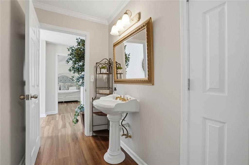 3675 Falls Trail Winston, GA 30187 - Photo 25 of 47 a bathroom with a sink a mirror and a shower