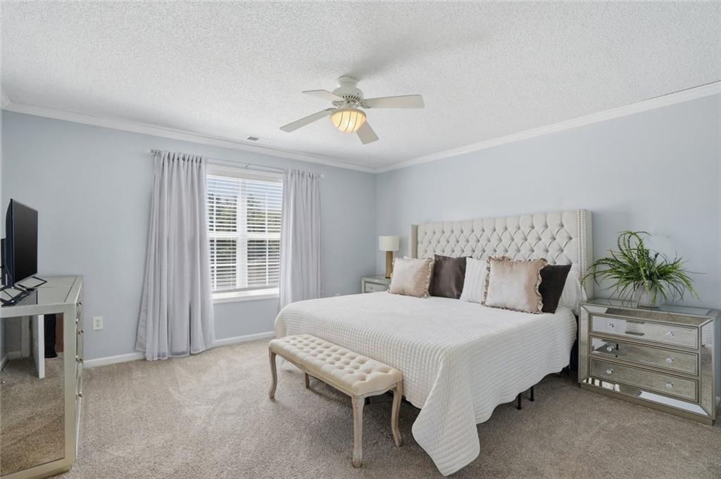 3675 Falls Trail Winston, GA 30187 - Photo 26 of 47 a bedroom with a bed and a chandelier