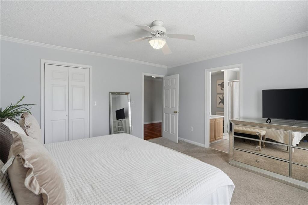 3675 Falls Trail Winston, GA 30187 - Photo 27 of 47 a bedroom with a bed and a flat screen tv