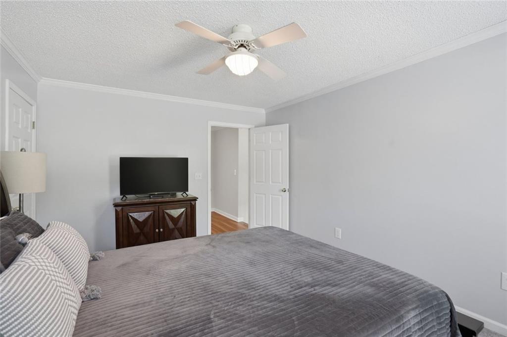 3675 Falls Trail Winston, GA 30187 - Photo 29 of 47 a bedroom with a bed and a flat screen tv