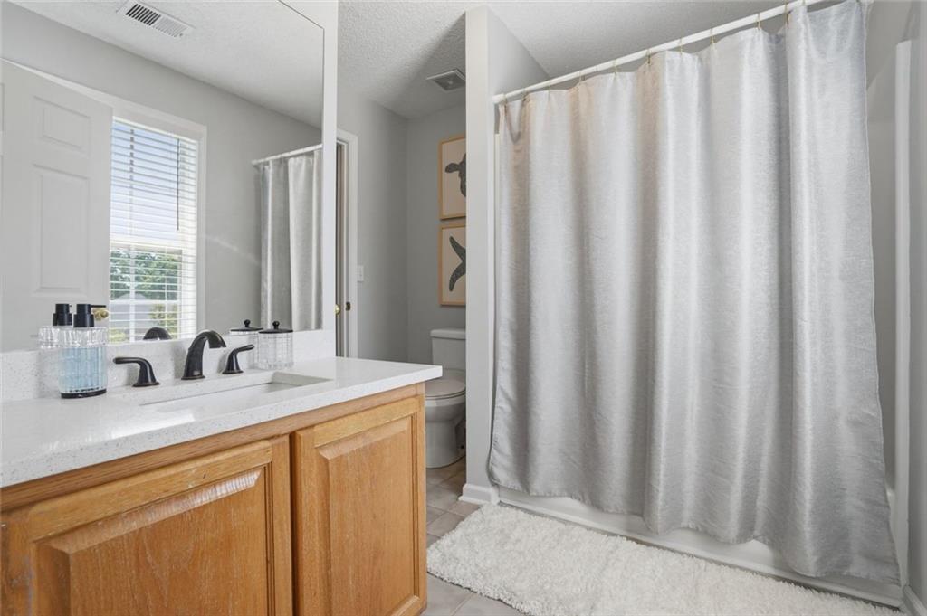 3675 Falls Trail Winston, GA 30187 - Photo 30 of 47 a bathroom with a granite countertop sink and a mirror
