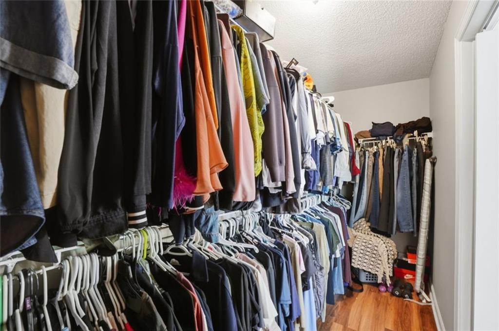 3675 Falls Trail Winston, GA 30187 - Photo 31 of 47 a view of walk in closet with clothes