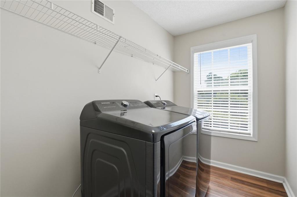 3675 Falls Trail Winston, GA 30187 - Photo 33 of 47 a utility room with wooden floor washer and dryer