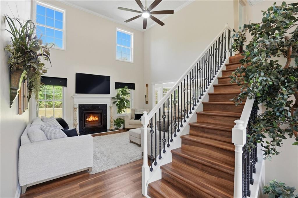3675 Falls Trail Winston, GA 30187 - Photo 8 of 47 a living room with wooden floor and a fireplace