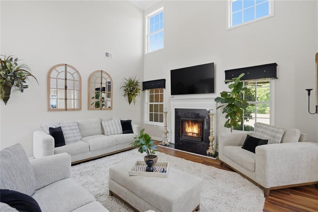 3675 Falls Trail Winston, GA 30187 - Photo 10 of 47 a living room with furniture a fireplace and a flat screen tv