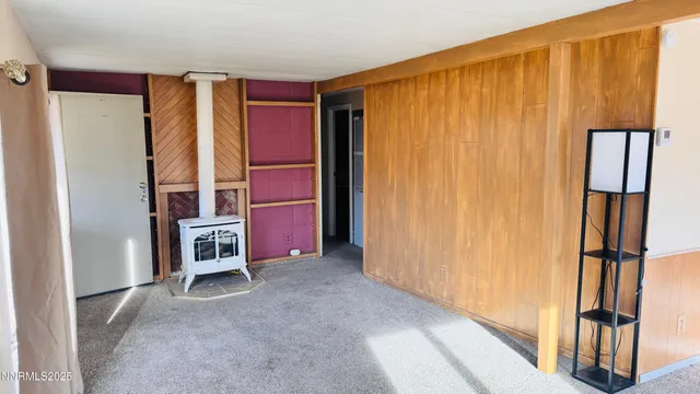 a kitchen with stainless steel appliances a sink a refrigerator a window and a stove