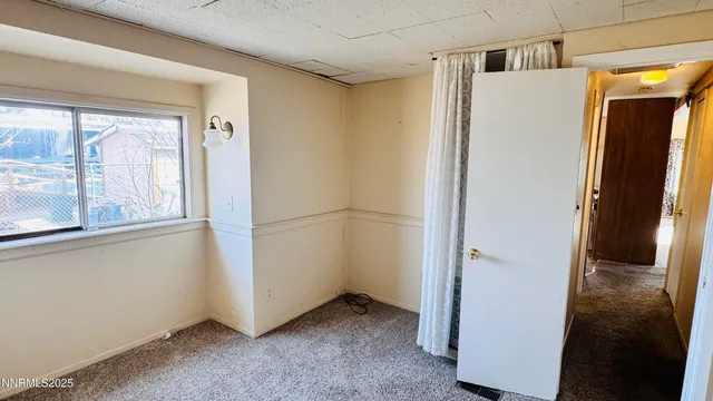 a view of a room with closet and wooden floor