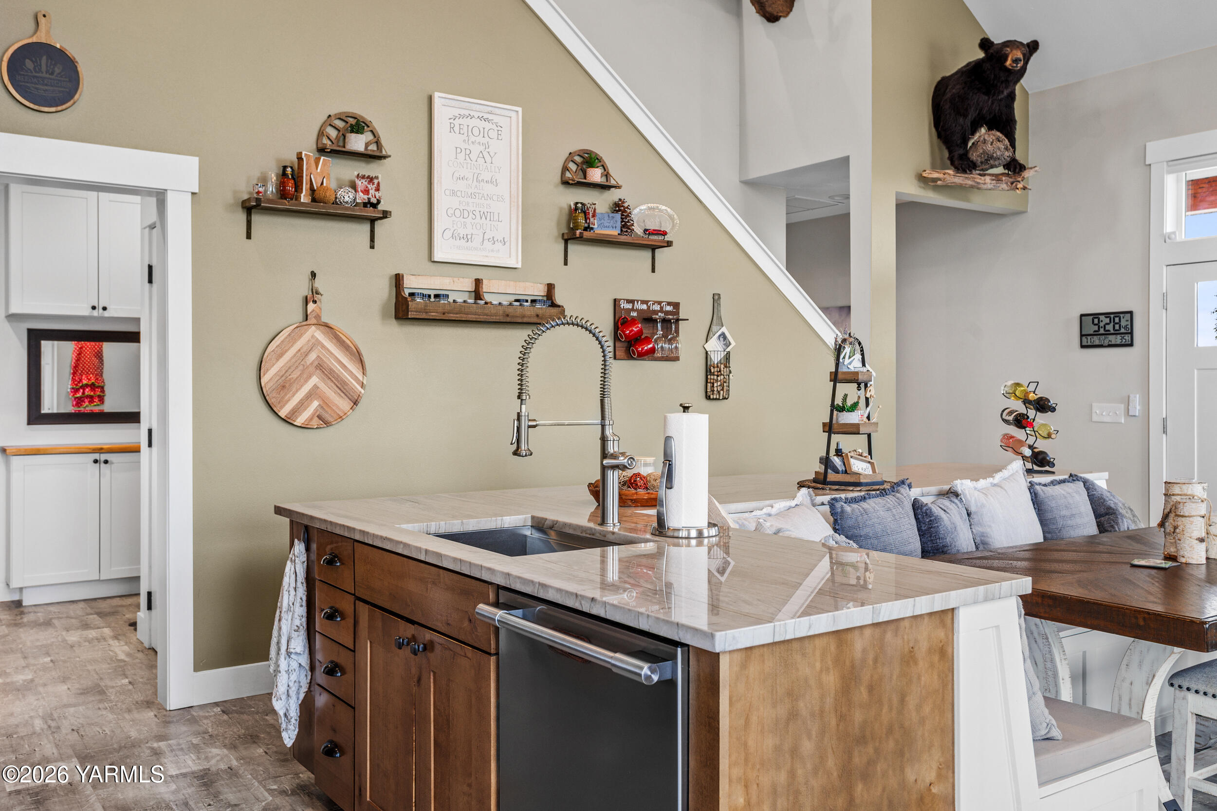 517 Game Ridge Road Selah, WA 98942 - Photo 20 of 72 a kitchen with a sink a clock and cabinets